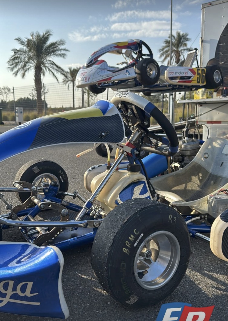 Karts lined up in the paddock at Kuwait Motor Town, ready for an open track session